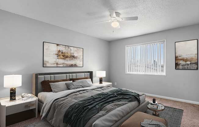 a bedroom with a bed and a ceiling fan