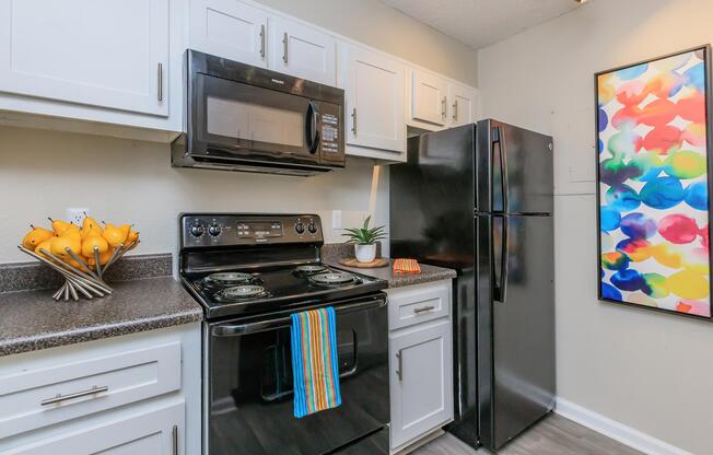 a kitchen with a stove and a refrigerator