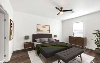 A bedroom with a bed, nightstand, and a plant.