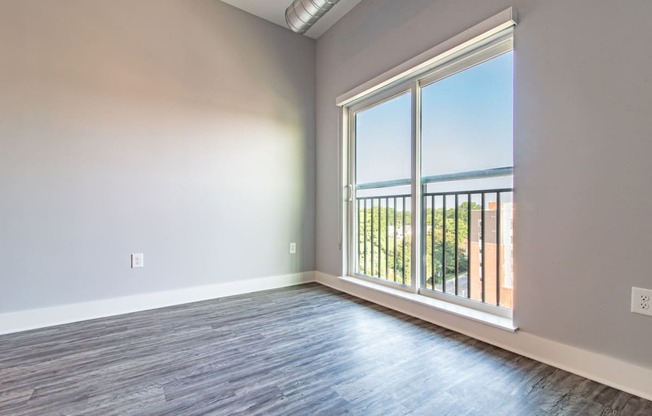 Living Area With Balcony at Novi Flats, Concord, North Carolina