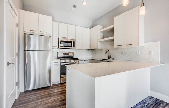 Kitchen with stainless steel appliances and white cabinets