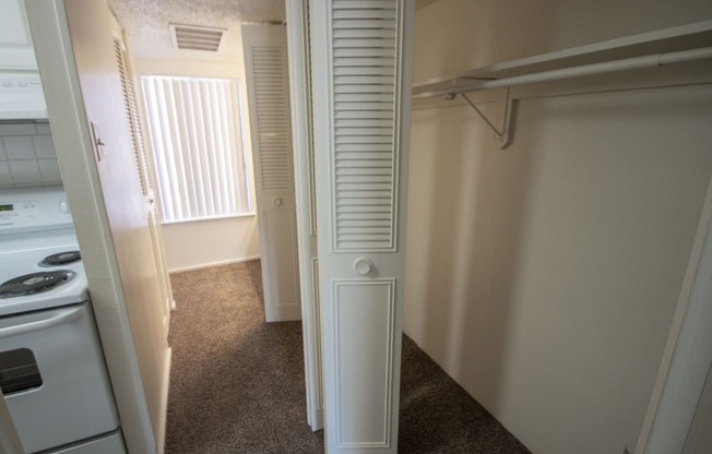 This is a photo of the hallway closet in the 500 square foot 1 bedroom apartment at Harvard Square Apartments, in Dallas, TX.