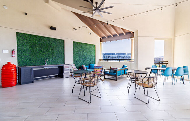 a restaurant with tables and chairs and a ceiling fan