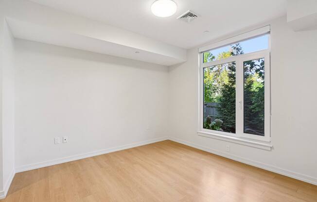 Bedroom with a window at Park77 Apartments, Cambridge