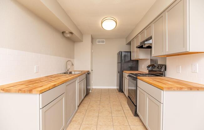 a kitchen with a tile floor