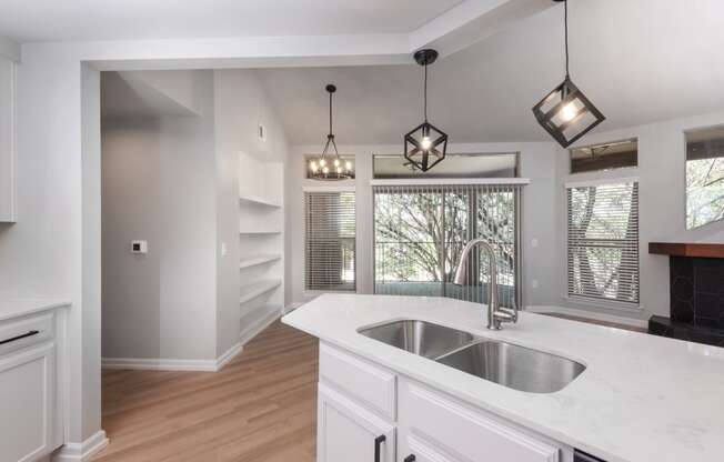 a kitchen with a sink and a window