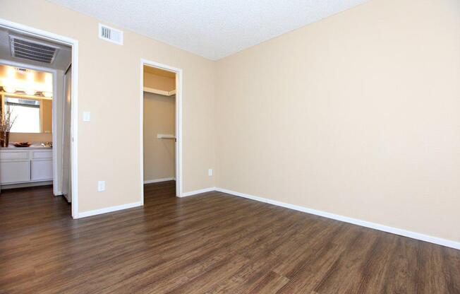 a large empty room with a wood floor