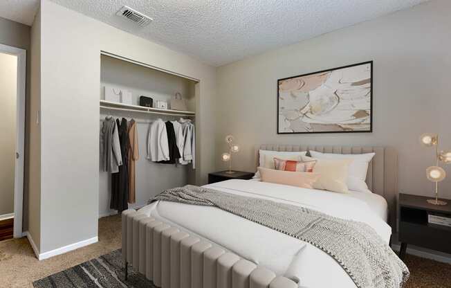 a bedroom with a large bed and a closet with a mirrored door