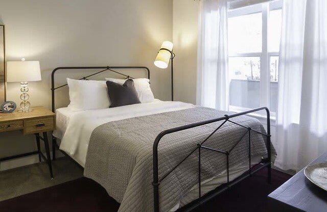 Bedroom With Expansive Windows at Parc West Apartments, Utah