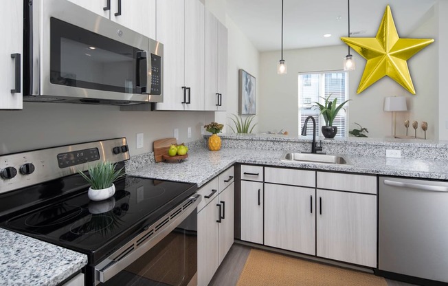 A modern kitchen with a black stove top oven and a black microwave above it.