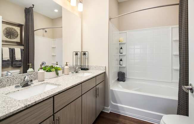Full bathroom with shower/tub combo and granite countertops at The Alexandria in Madison, AL