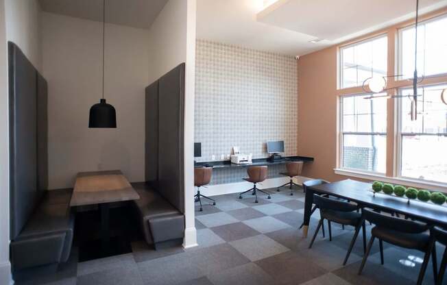 A modern kitchen with a dining table and chairs.