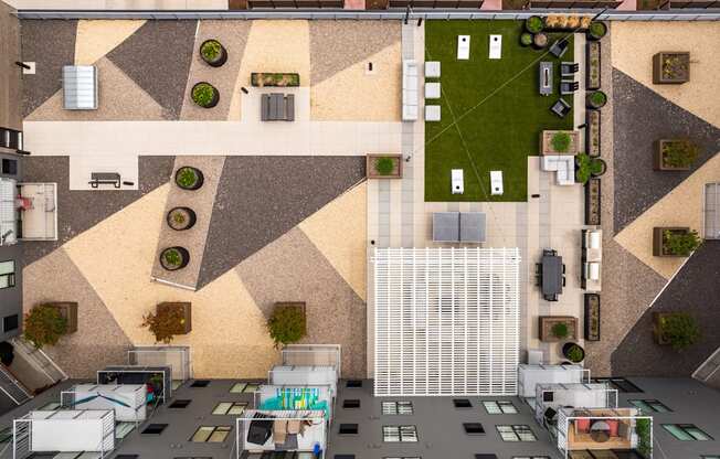 an aerial view of a building with a courtyard and grass at EagleRidge Plaza Residences, Fargo, ND