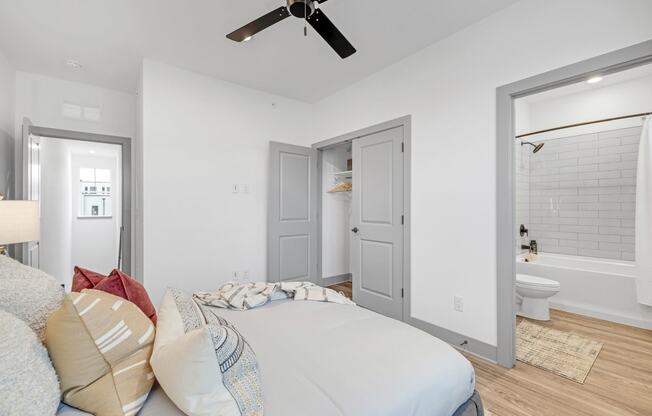 a bedroom with a large bed and a ceiling fan at Meridian at CityPlace, Minnesota, 55125