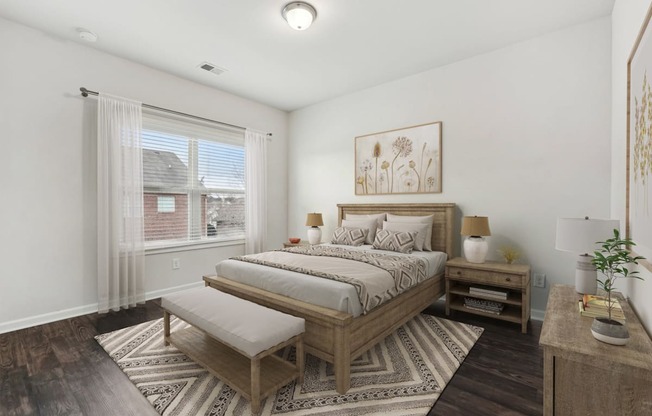 A bedroom with a large bed and a bench in front of it.