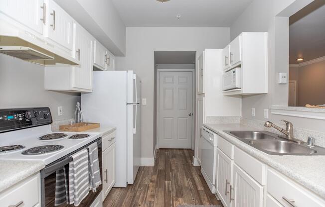 a kitchen with a stove and a sink