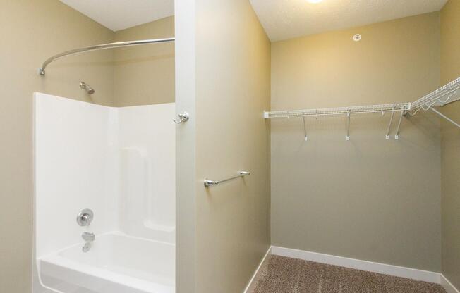 a shower that has a sink and a mirror