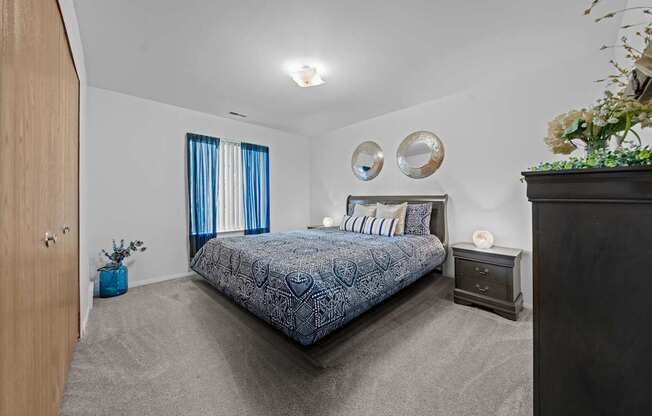 Cozy bedroom with natural light at Westwood Village Apartments in Westland, MI