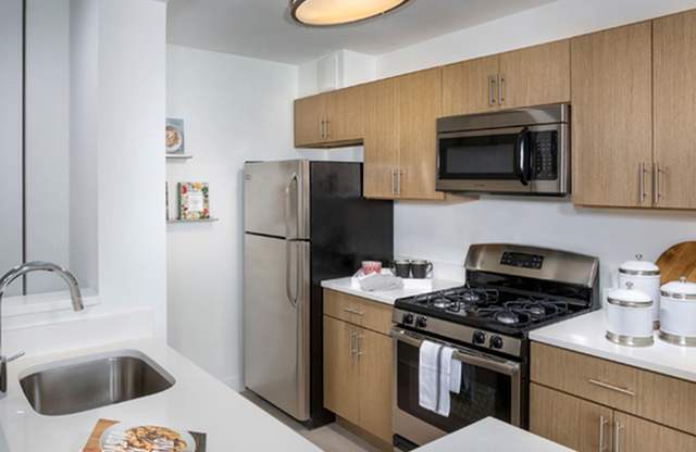 Kitchen with stove top oven at The Graham at Southern Towers, Alexandria, Virginia, 22311