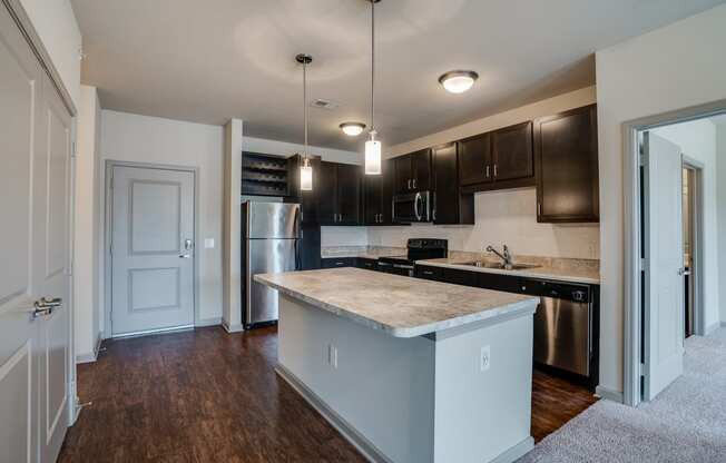Open Concept Kitchen with Stainless Steel Appliances
