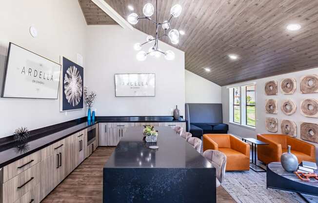 a kitchen and living room with a table and chairs