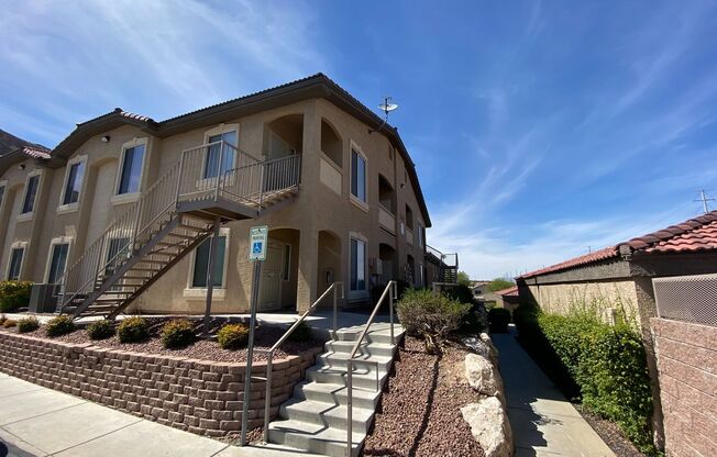 BEAUTIFUL CONDO IN A GATED COMMUNITY FEATURING PLANTATION SHUTTERS, TILE FLOORING AND NEW PAINT THROUGHOUT!