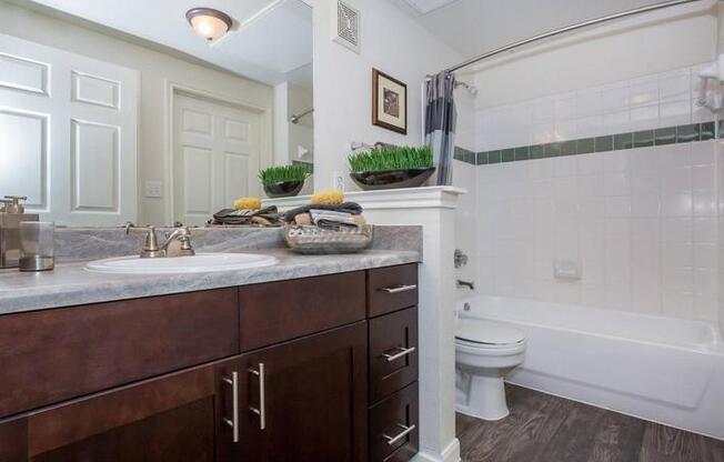 A bathroom with a white toilet and a white sink.