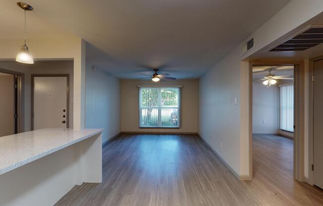 a large empty room with a wood floor