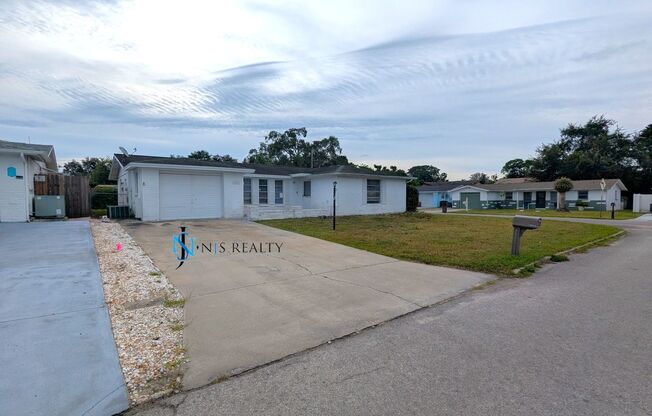 Fresh paint throughout this 3/2/1 1400 Sq. Ft. with fenced yard, tile flooring, HUGE kitchen and indoor laundry with a screen porch!!