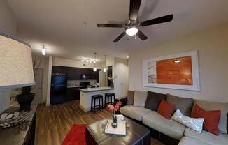 a living room filled with furniture and a flat screen tv