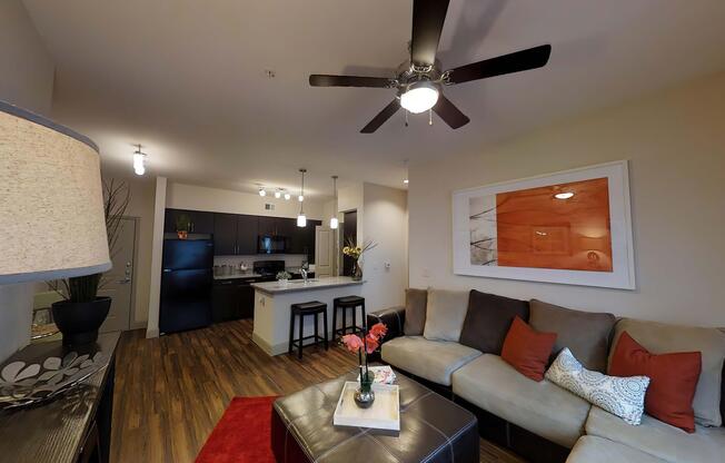 a living room filled with furniture and a flat screen tv