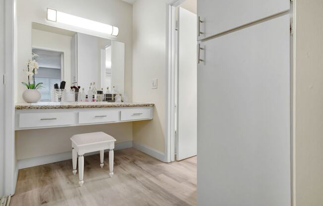 a bathroom with a vanity and a mirror