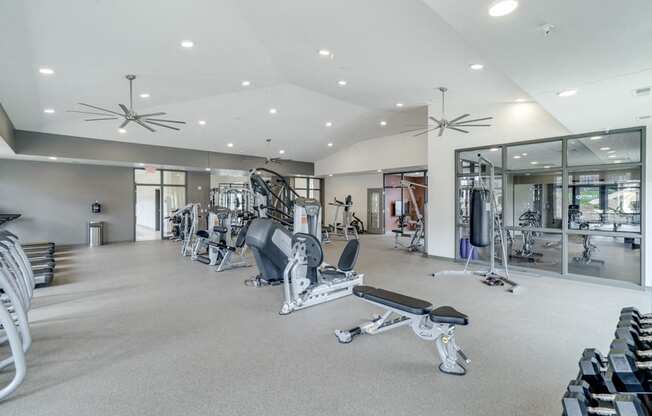 Large fitness center with free weights, weightlifting machines and cardio equipment at Ascend at Woodbury in MN