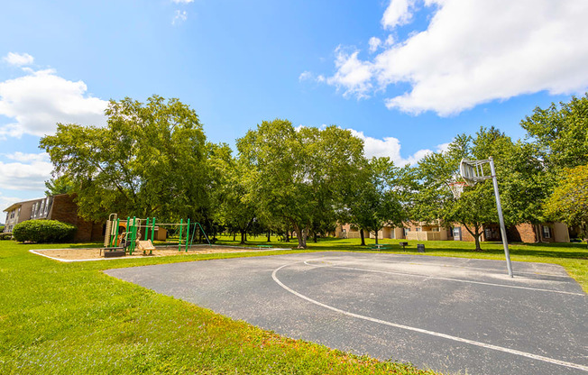 Basketball court at Briarwood Apartments, Columbus, IN, with hoops and a paved playing surface.