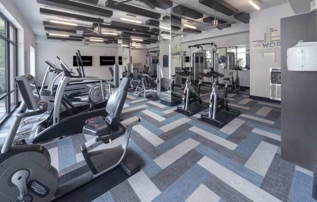 a gym with treadmills and other exercise equipment at The Hendrix, Atlanta, Georgia