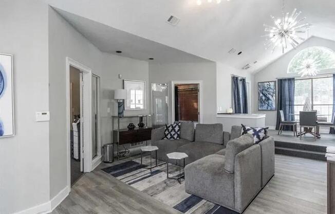 a living room with a couch and a table at The Sapphire, Decatur, GA