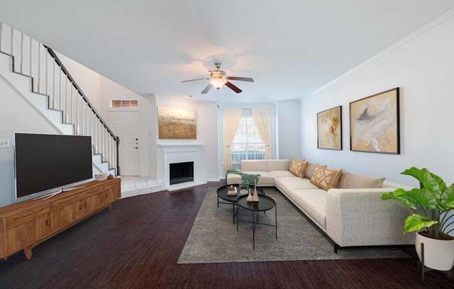 a living room with a couch and a tv