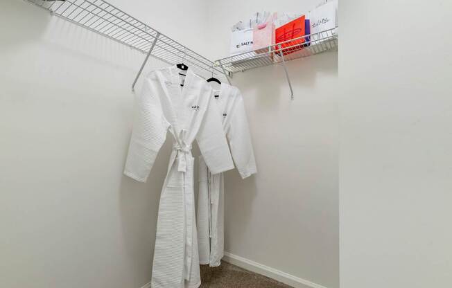 spacious closet with white robes and hangers in a studio apartment at Pier Village Apartments, Long Branch, NJ, 07740