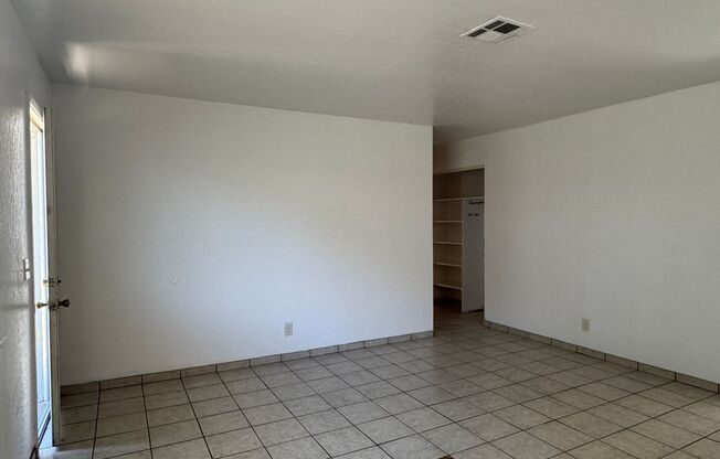 Two Bedroom Triplex with One Bathroom and Garage