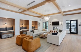 a rendering of a lobby with couches and chairs