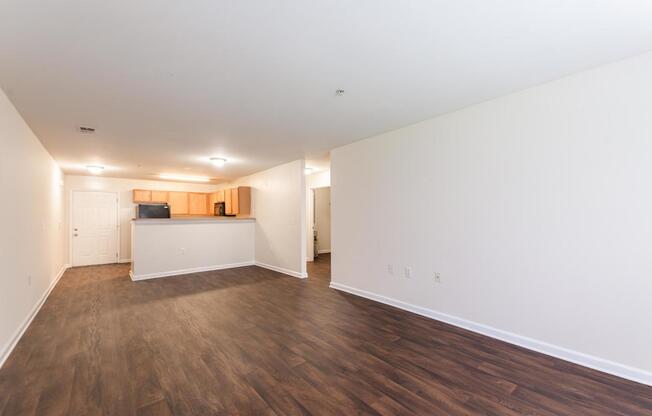 A room with wooden floors and white walls.