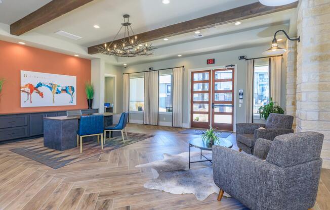 a living room filled with furniture and a large window