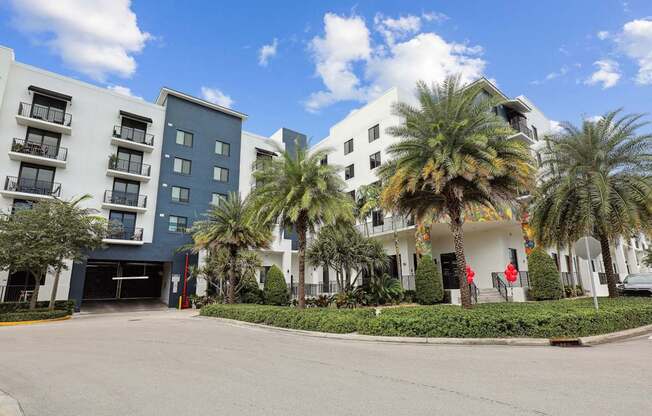 Shot of our building and entrance to parking garage with automatic gates at Bay Village 1 in Palmetto Bay, FL