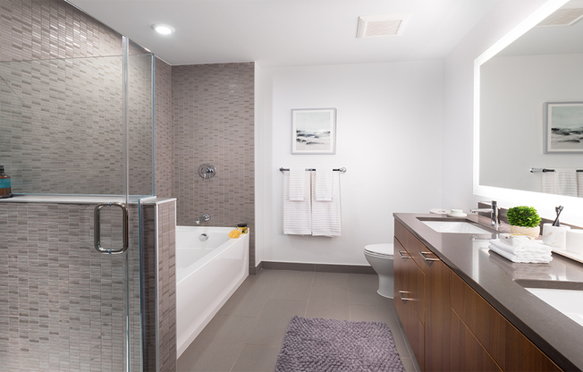 Serene bathrooms with spa-like soaking tubs, glass showers with subway tile surrounds