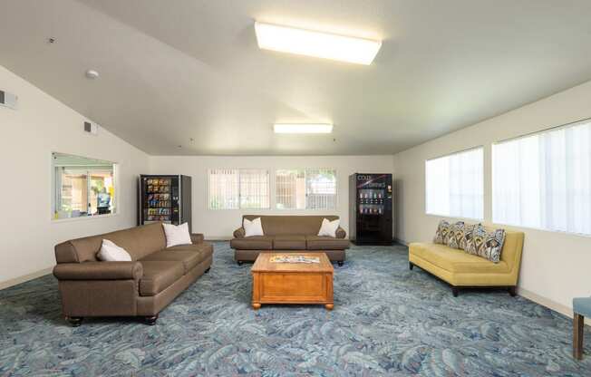 a living room with couches and a coffee table