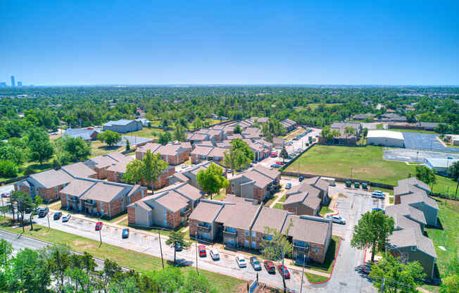 an aerial view of a neighborhood with houses and a parking lot