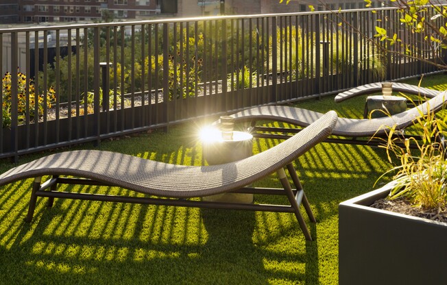 Unwind in style at Mabel, where serene outdoor spaces invite relaxation. Enjoy sun-drenched lounge chairs and lush landscaping, perfect for your leisure moments. Explore the tranquility that awaits you today!