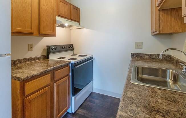 This is a photo of the kitchen in a 950 square foot, standard 2 bedroom apartment at Deer Hill Apartments in Cincinnati, OH.