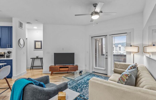 a living room with a couch and a tv