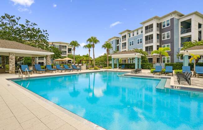 Beautiful resort-style pool at Dunedin Commons apartments in Dunedin, FL